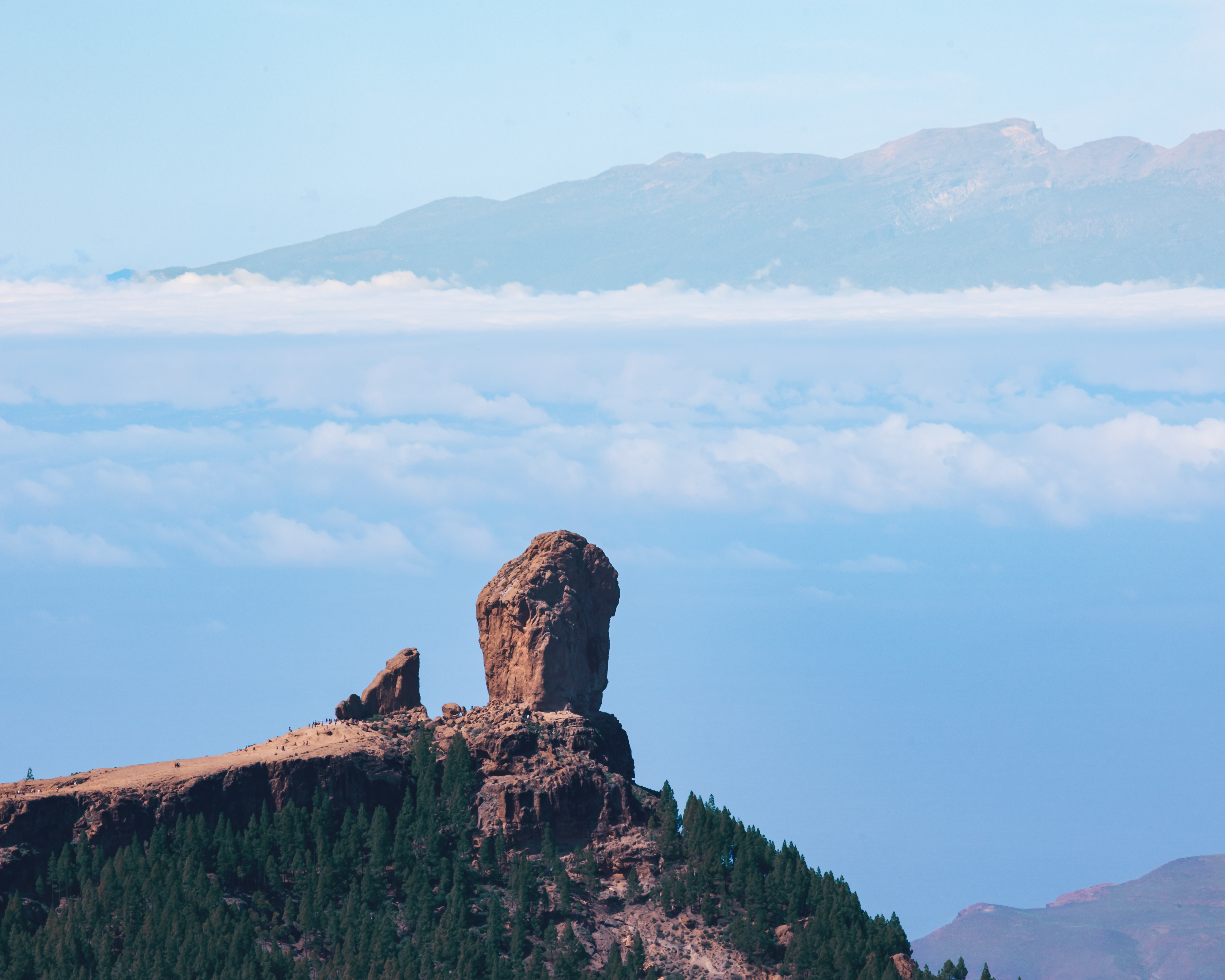 Close up of Roque Nublo, seen from Pico de las Nieves. You can se hikers next to the rock to get a estimate of the size of the rock.