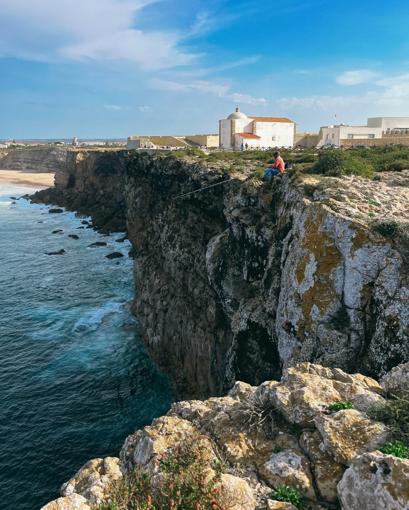 Fisherman on the cliff close to the fortress in Sagres, Algarve, Portugal