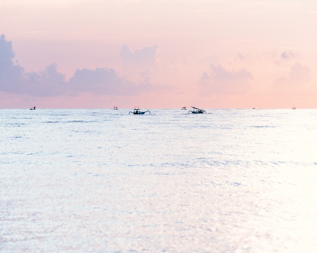Fishing boats at sea on Galugan morning in Amed, East Bali 2022