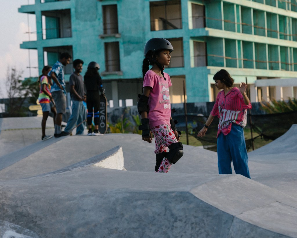 Girl skateboarding on the island of Hulumale in the Maldives at the local skatepark