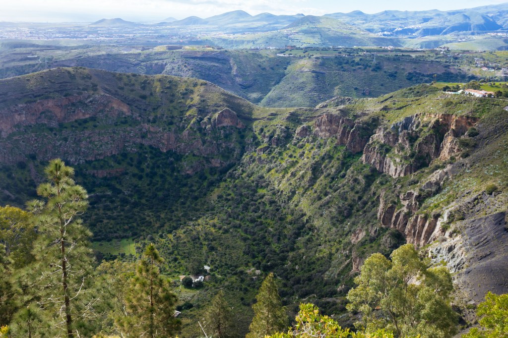 Volcanic canyon close to Las Palmas on Gran Canaria where a family used to live on the bottom. The ruins are still visible at the bottom. February 2023.