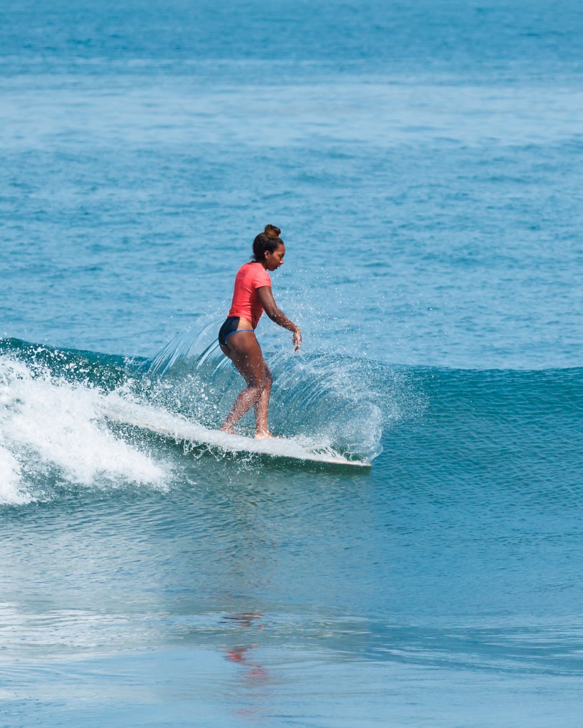 Nique Miller surfing in the sea at Playa Los Pintos, Mexi Log Fest, Mazatlán, Mexico