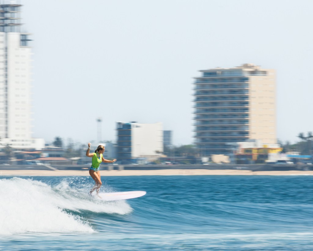 Female surfer at Playa Los Pintos, Mexi Log Fest, Mazatlán, Mexico
