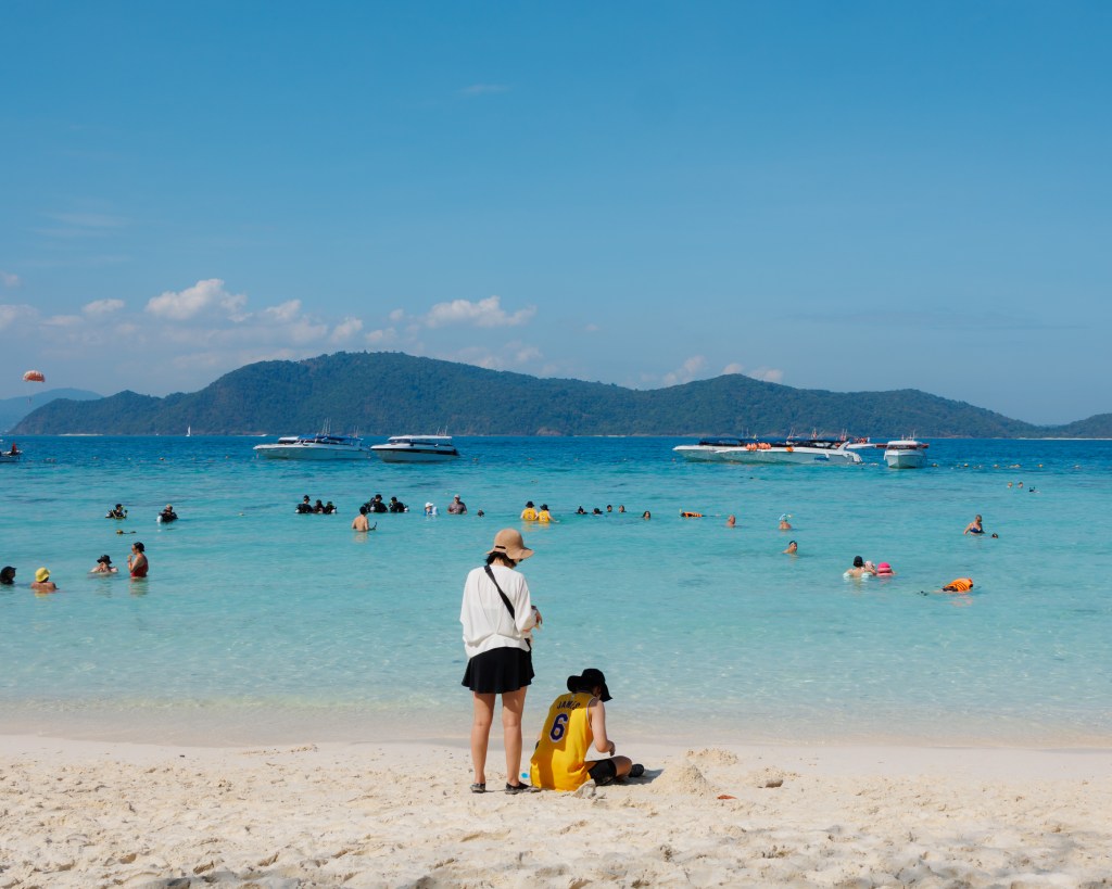 Tourists on the beach and in the sea while on a snorkeling trip in Thailand, January 2026