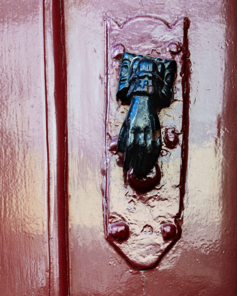 Door knob in the shape of a hand in Porto, Portugal