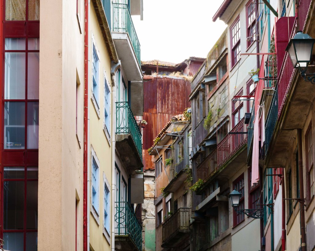 Narrow alley in Porto, Portugal. Houses crammed into each other.