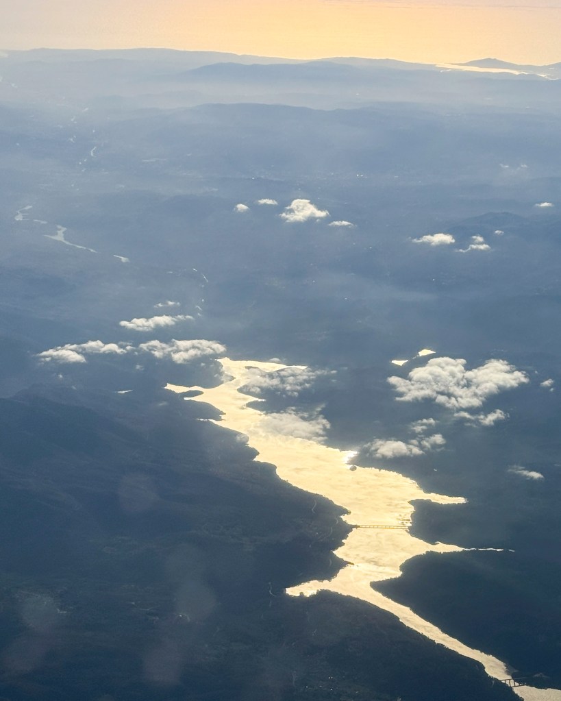 The Douro River looking like gold from a sunset flight into Porto, Portugal