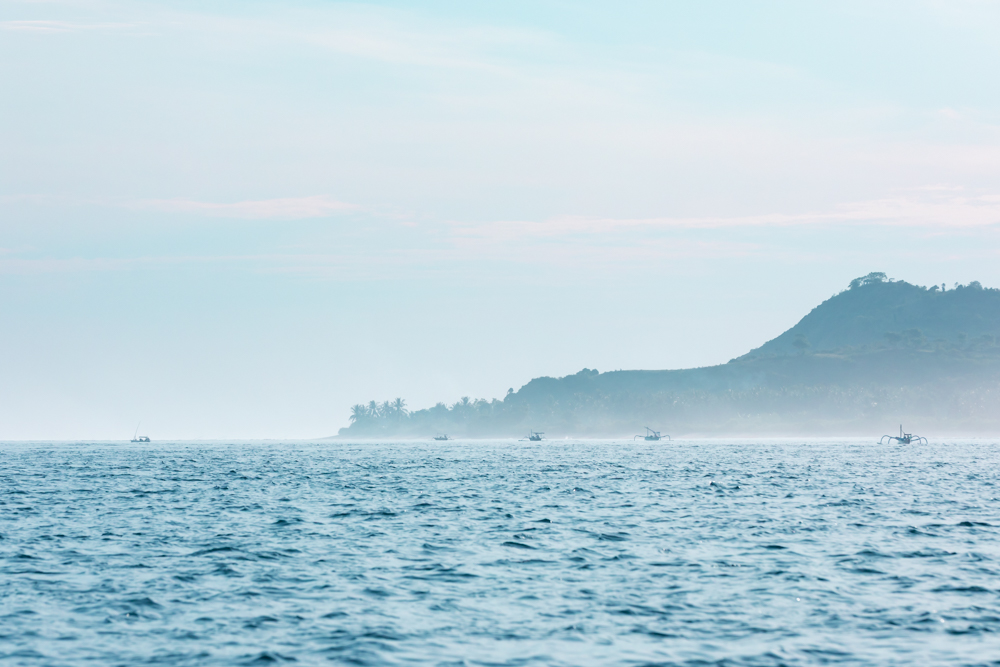 Fishing boats outside the coast of Lombok at sunrise, Indonesia